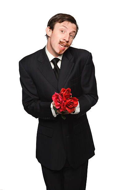 Guy with a handlebar mustache holding flowers. A blind date perhaps?