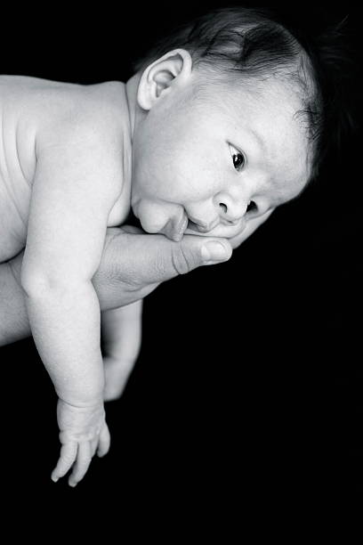 istock Newborn Baby in Father's Hand 183365897