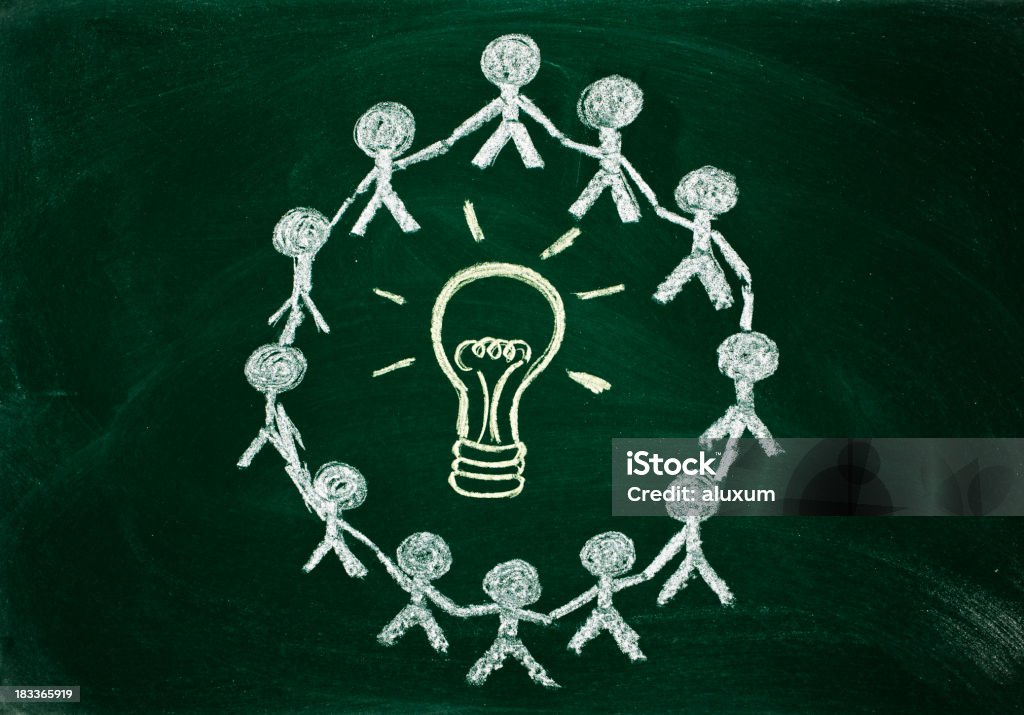 surrounding lighbulb innovation and cooperation concept on chalkboard Brainstorming Stock Photo
