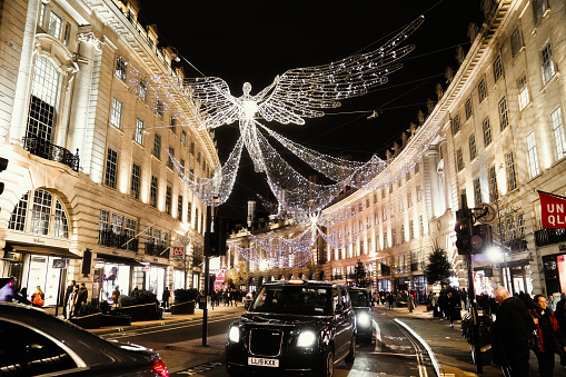 Regent Street Central London England United Kingdom — December 2023: Christmas Lights at Regent Street in Central London, UK. Regent Street and St James’s Christmas lights.

Featuring 45 large-scale positioned as if playing trumpets, the ‘Spirits of Christmas’ light display covers Regent’s Street and St James and is made up of hundreds of thousands of individual LED lights.