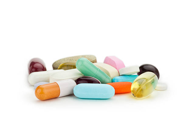 mezcló medicina, los comprimidos y de las cápsulas - vitamin a nutritional supplement pill capsule fotografías e imágenes de stock