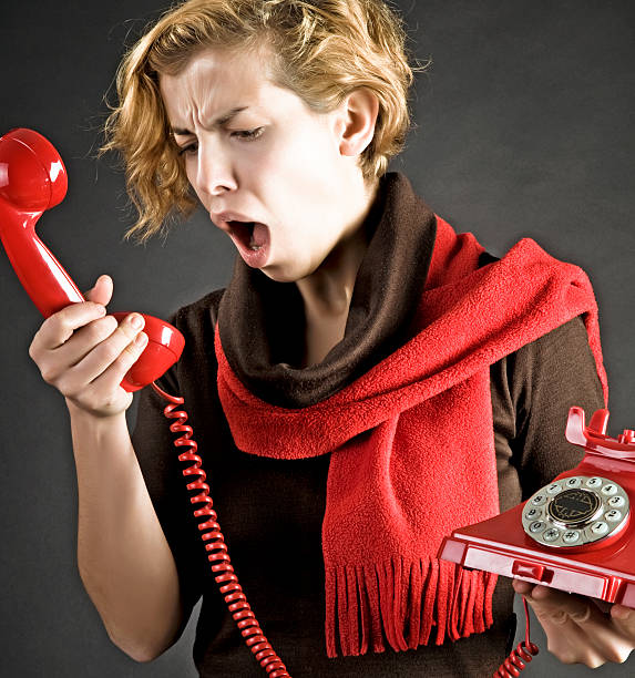 istock Young Woman shouting into telephone 183367528