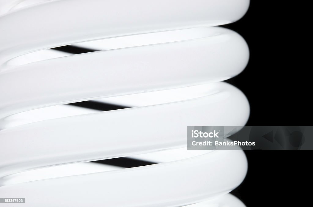 Compact Fluorescent Lightbulb Coils Isolated on Black  Light - Natural Phenomenon Stock Photo