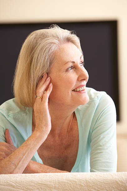 istock Senior Woman Watching Widescreen TV At Home 183367699