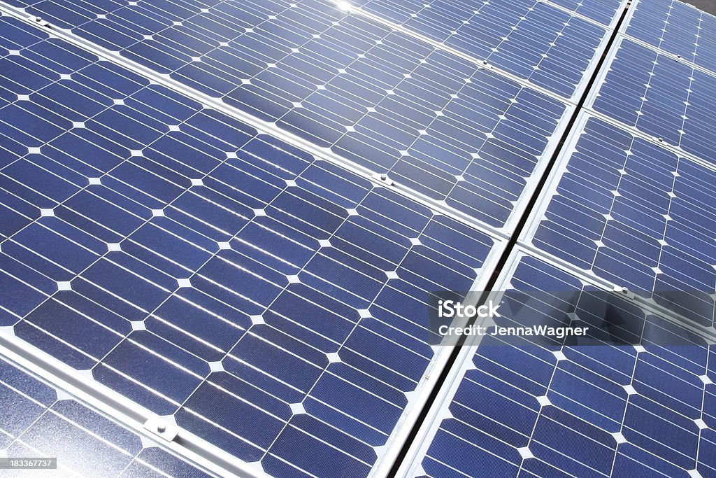 Solar Panels "Full frame view of solar panels in Arizona, USA. Blue panels with sunlight reflecting." Arizona Stock Photo