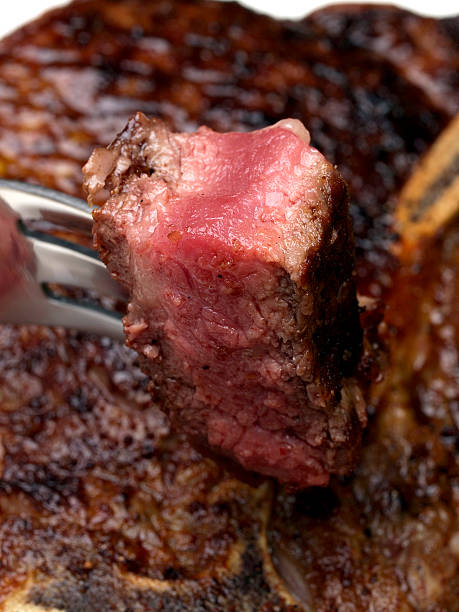 istock Bite of rare Strip Steak 183368395