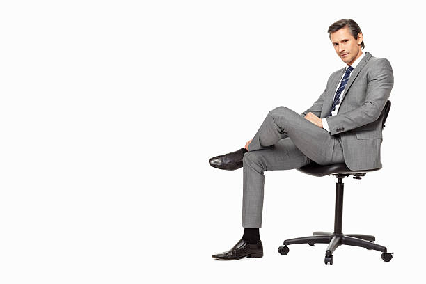 istock Business man sitting in a chair against white background 183368435