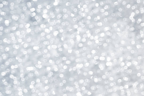 Silver sparkles coming from the reflection of the river
