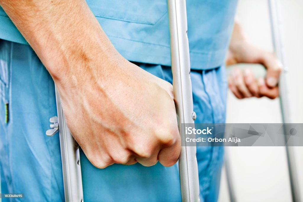 Patient with crutches Crutch Stock Photo