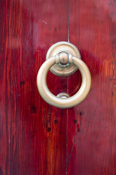 istock Brass Knob Knocker On A Wood Door 183369244