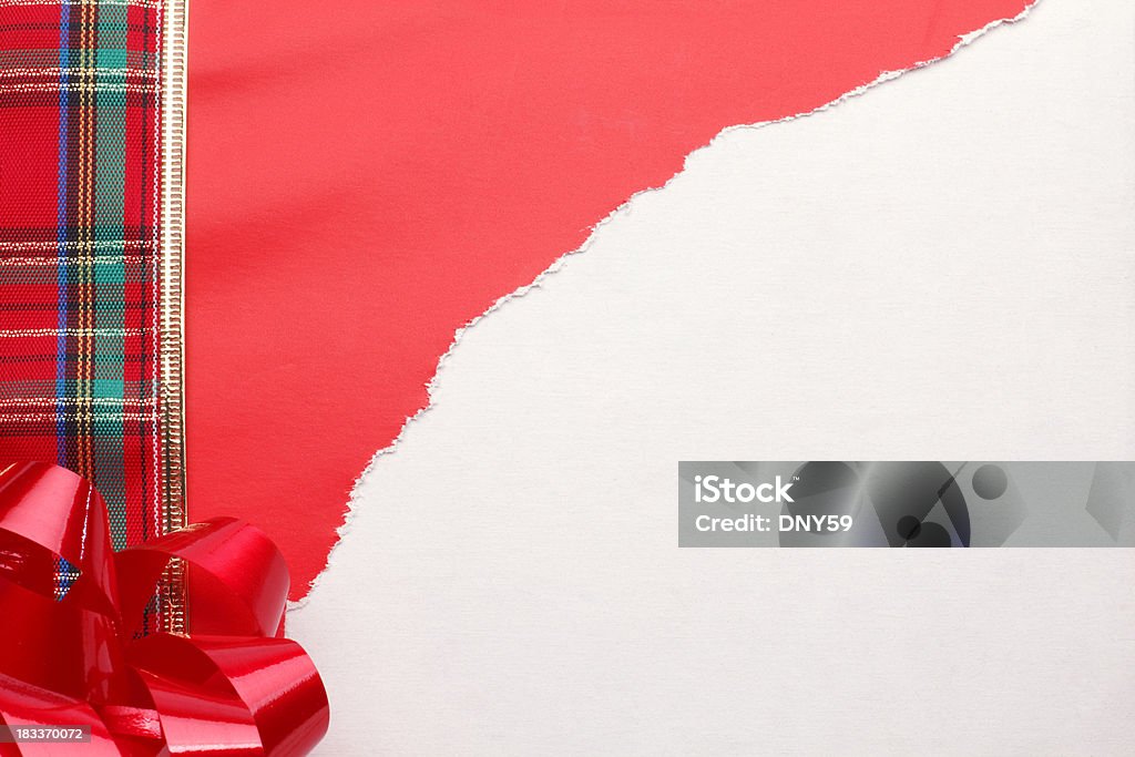 Opened Christmas Present "A plaid ribbon,bow, and ripped open red gift wrap.To see more holiday images click on the link below:" Torn Stock Photo