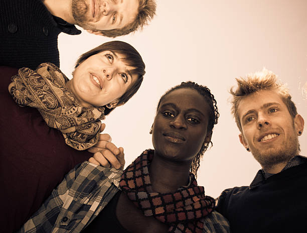 istock Friends embraced and Shot from Below - teamwork 183370428