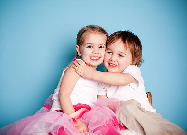 Cute Brother and Sister Loving Each Other with Hugs stock photo