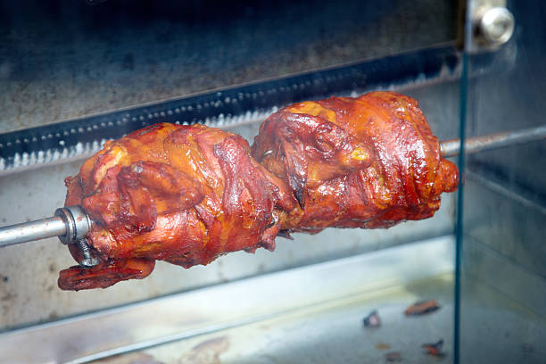 istock Fresh chicken on a rotisserie 183370529