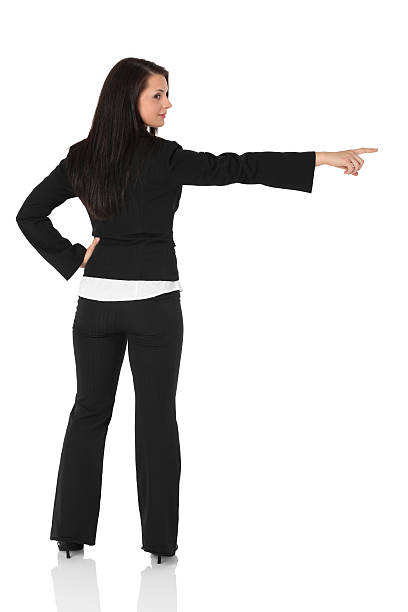 istock Rear view of businesswoman pointing sideways 183371821