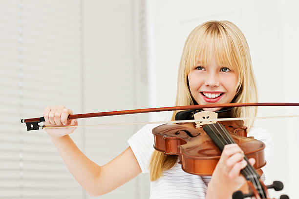 istock Young Girl Smiling With a Violin 183372642