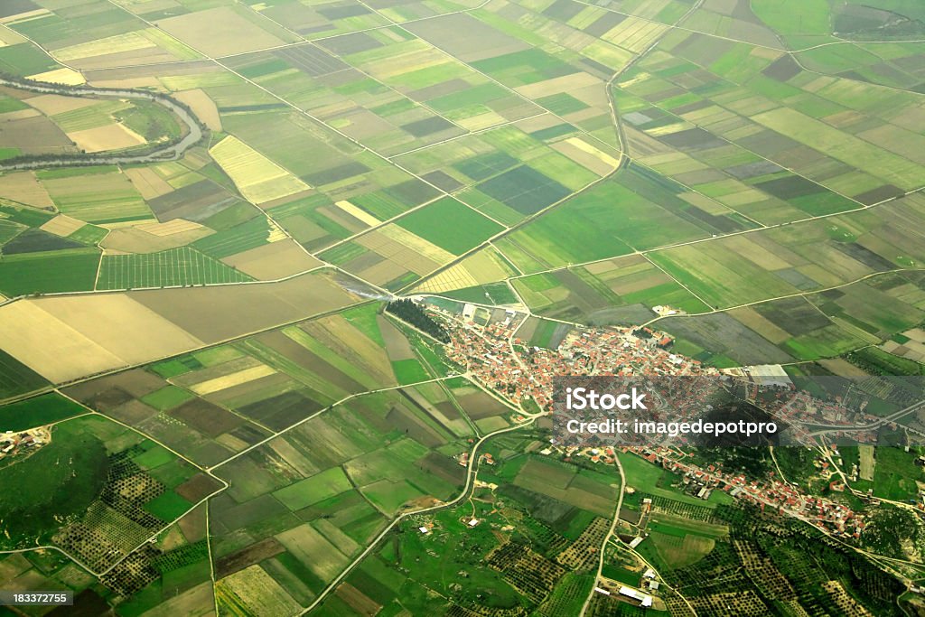small town elevated view of farm fields and small town in Izmir, Turkey. Land Stock Photo