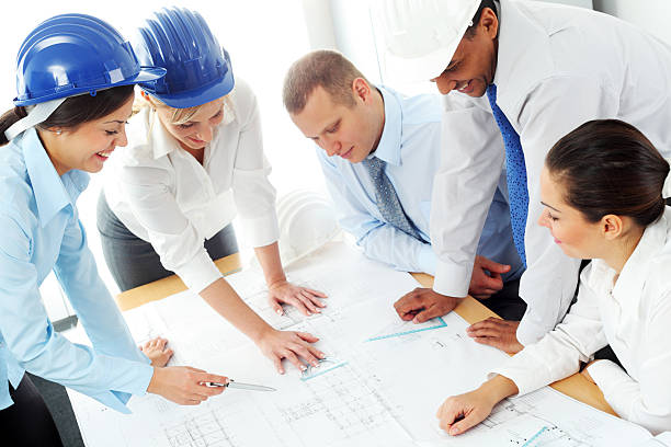istock Large group of young architected are studding plans. 183373574