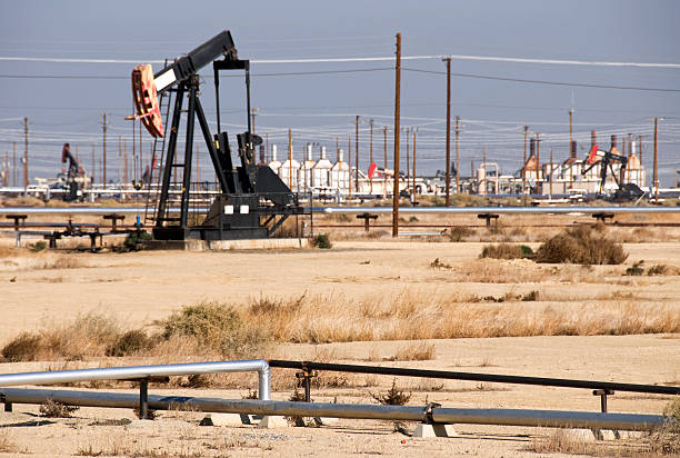 istock Pump jacks in oil field 183373675