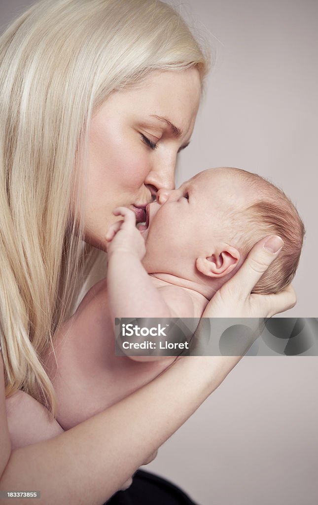 Mother kissing baby Mother and baby.YOU MIGHT ALSO LIKE: Beauty Stock Photo