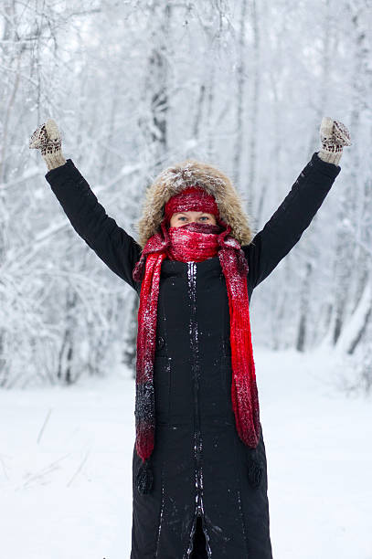 istock Woman in winter forest with arms outstretched 183374719