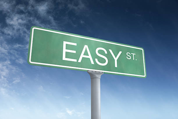 Easy Street Sign Green street sign that reads Easy St with a blue sky in the background.Could symbolize the easy life.This is a detailed 3d rendering. no brainer sign stock pictures, royalty-free photos & images
