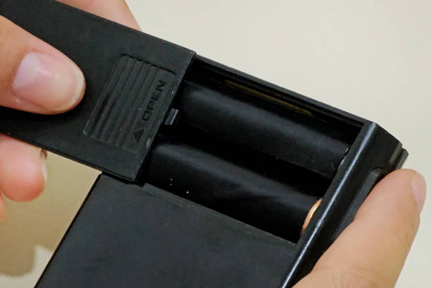 istock Putting batteries in an old calculator 1833752030