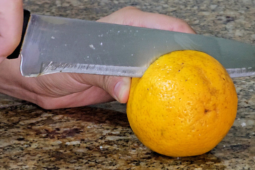 Cutting an orange