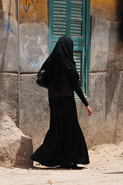 istock Conservatively dressed Muslim woman in Luxor, Egypt 183375388