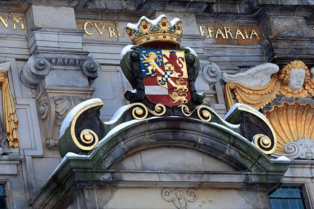 coat of arms on Delft's Town Hall in winter "coat of arms above the entrance of Delft's Town Hall in Renaissance style by architect Hendrick de Keyser; Delft, Netherlands" delft winter netherlands snow stock pictures, royalty-free photos & images