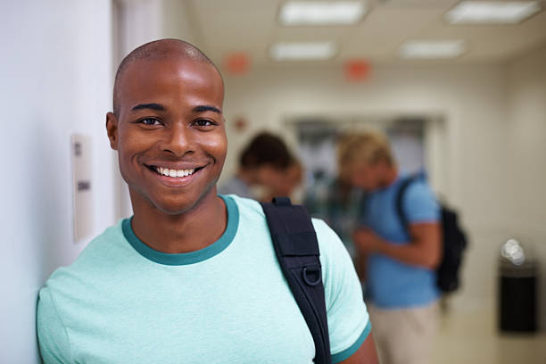 istock Happy African American student with friends in background 183375678