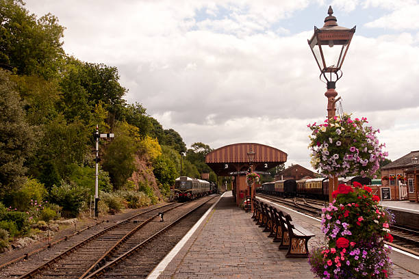 istock The train now arriving- old fashioned steam railway station. 183375795