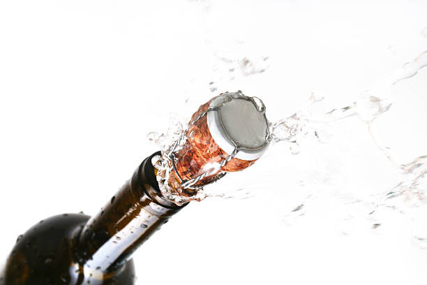 champagne cork popping stock photo