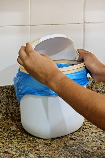 istock Placing the bag in the bin 1833759579