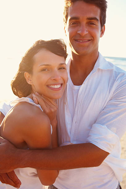 istock Happy couple embracing on beach 183375987