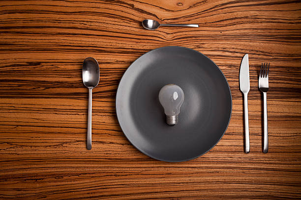 istock table setup with a bulb instead of food 183376020