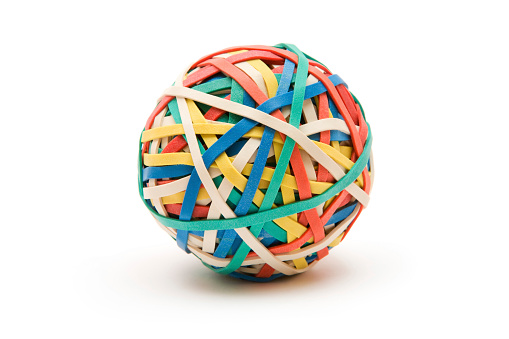 Ball made of multi colored rubber bands. Isolated on a white background.