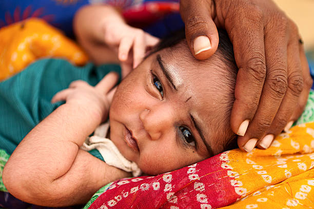 Indian woman with her newborn child, Thar Desert, Rajasthan, India.http://bem.2be.pl/IS/rajasthan_380.jpg