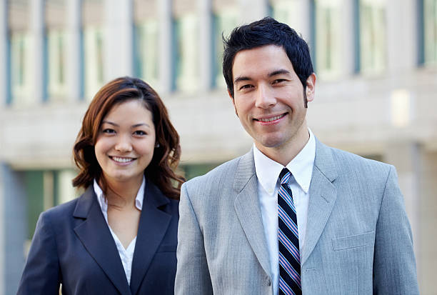 istock Portrait of two smart executives in suit smiling 183376193