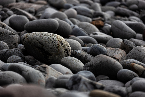 Stones on a pebble beach during sunset. Croatia, Brela, Makarska. Summer and Vacation concept.