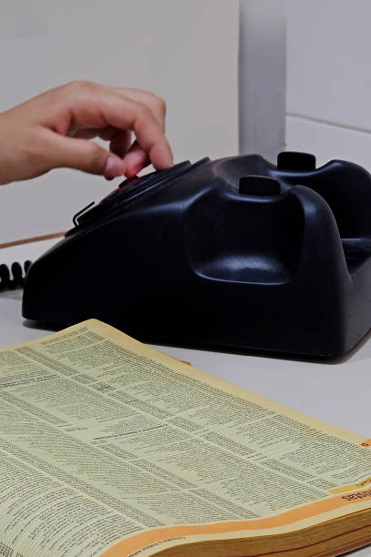 Old telephone and yellow pages. Products of the 70´s and 80´s.