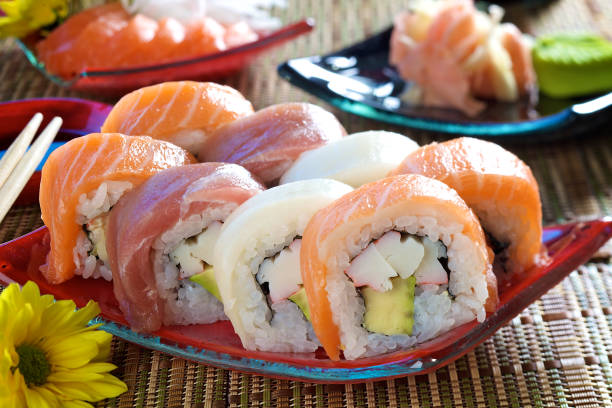 Rainbow Maki Sushi Rainbow futomaki with crab and avocado rainbow crab stock pictures, royalty-free photos & images