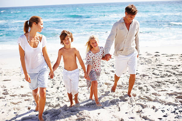 istock Happy family at the beach 183377304
