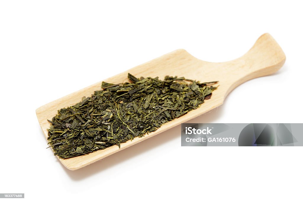 Du thé vert et de cuillère en bois - Photo de Aliments et boissons libre de droits