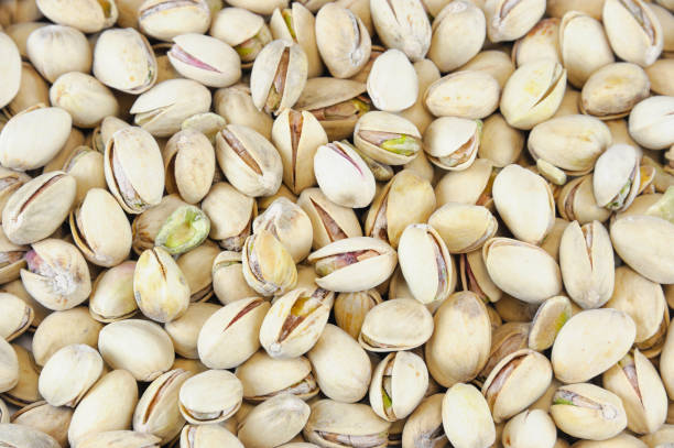 istock roasted Pistachios texture as food background 1833781036