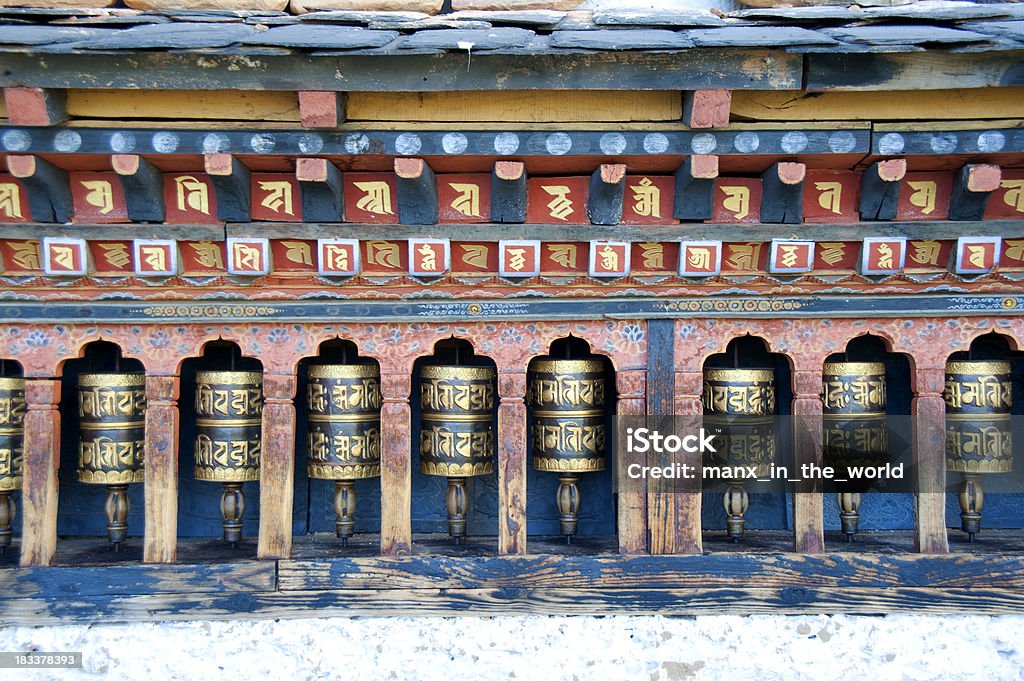 Buddhist Prayer Wheels at Changangkha Temple, Bhutan Buddhist prayer wheels at the famous Changangkha Lhakhang in Thimphu, the capital of Bhutan.  It is one of the oldes temples in the valley.  Inside the wheels scrolls of prayers. By turning this  wheels, the prayers are spread. Bhutan Stock Photo