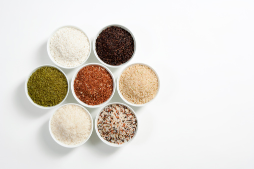 An assortment of alternative, gluten-free flours. Baking ingredients background: gluten free rice, corn, oatmeal on a white wooden background,. Copy space, top view.