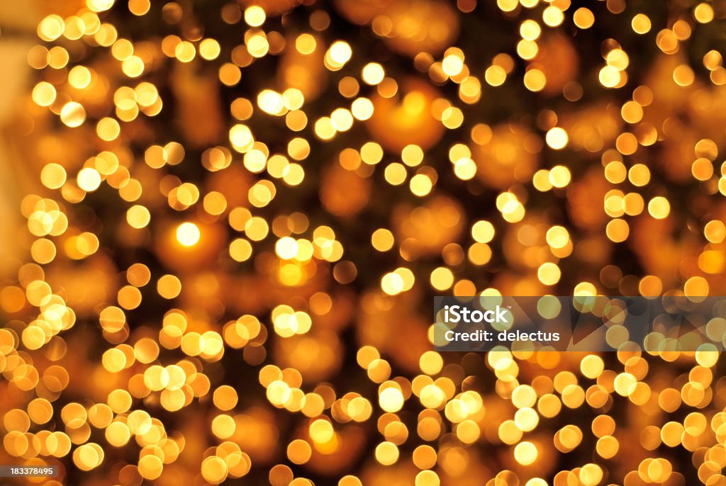 Glittering golden background bright golden background - defocus golden lights. Abstract Stock Photo