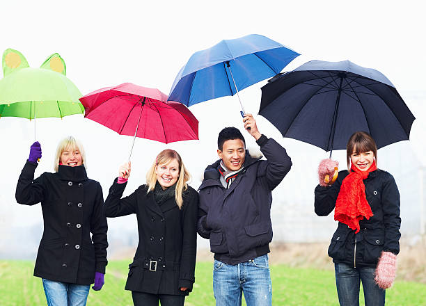 istock Young teens holding umbrellas 183378767