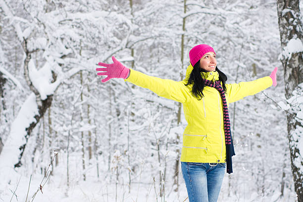 istock Woman in winter forest with arms outstretched 183379178